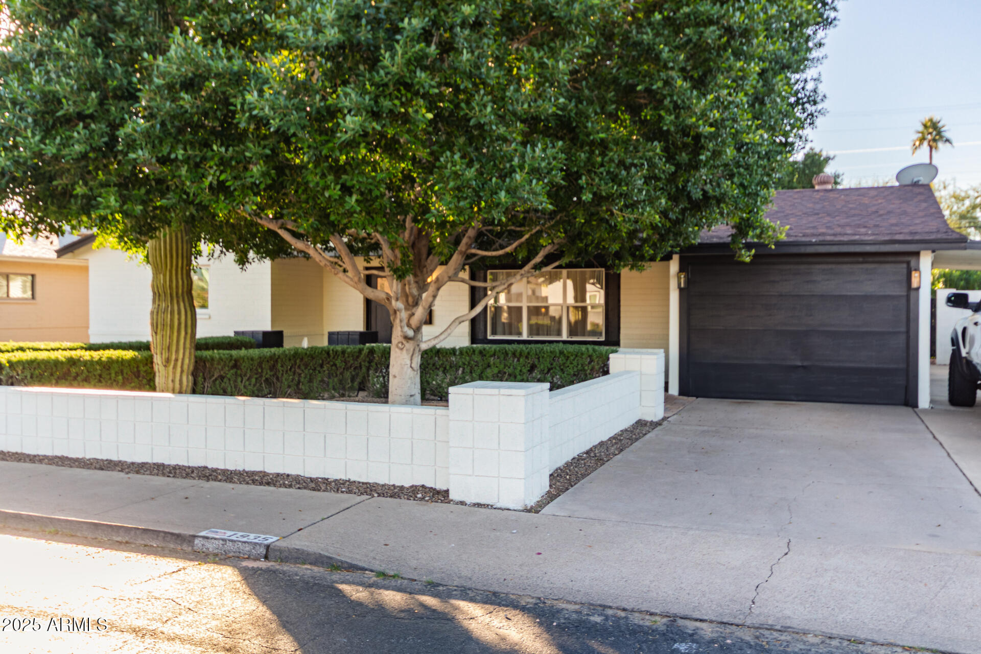 1935 East Coolidge Street Phoenix, AZ 85016 - Photo 2 of 34 a house with a tree in front of it