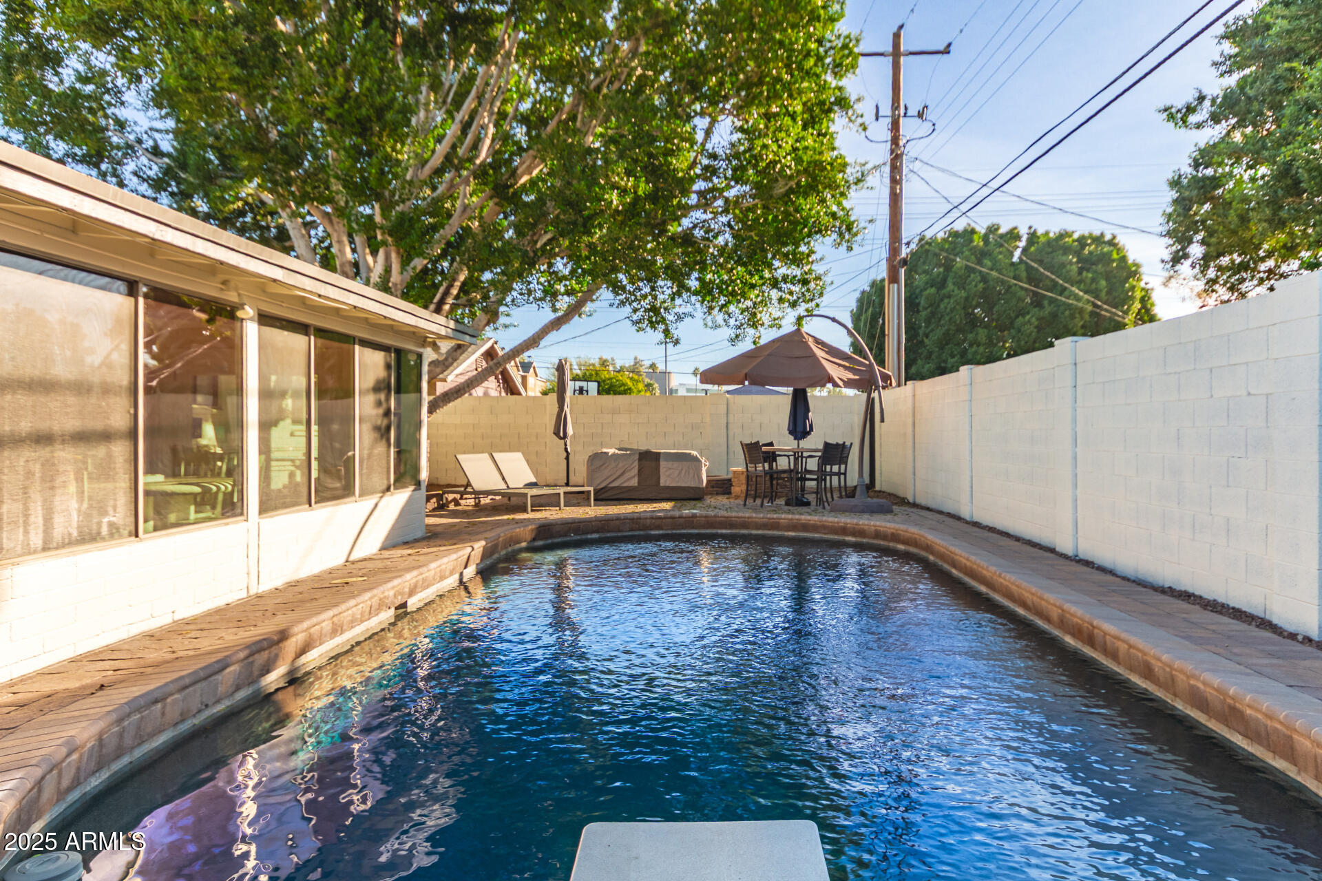 1935 East Coolidge Street Phoenix, AZ 85016 - Photo 33 of 34 a view of a swimming pool with a patio