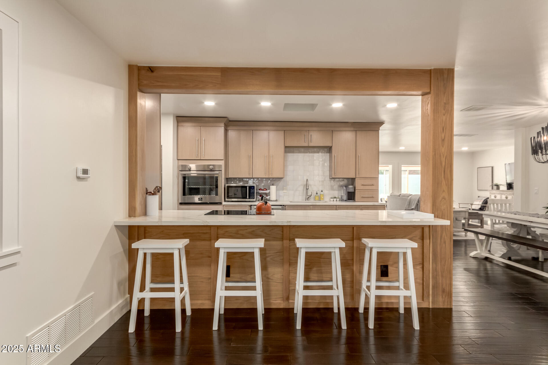 1935 East Coolidge Street Phoenix, AZ 85016 - Photo 4 of 34 a kitchen with stainless steel appliances granite countertop a stove a sink and a refrigerator
