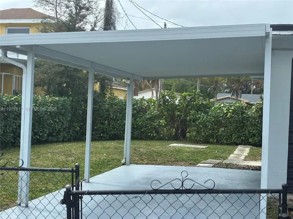 a view of a back yard from a balcony
