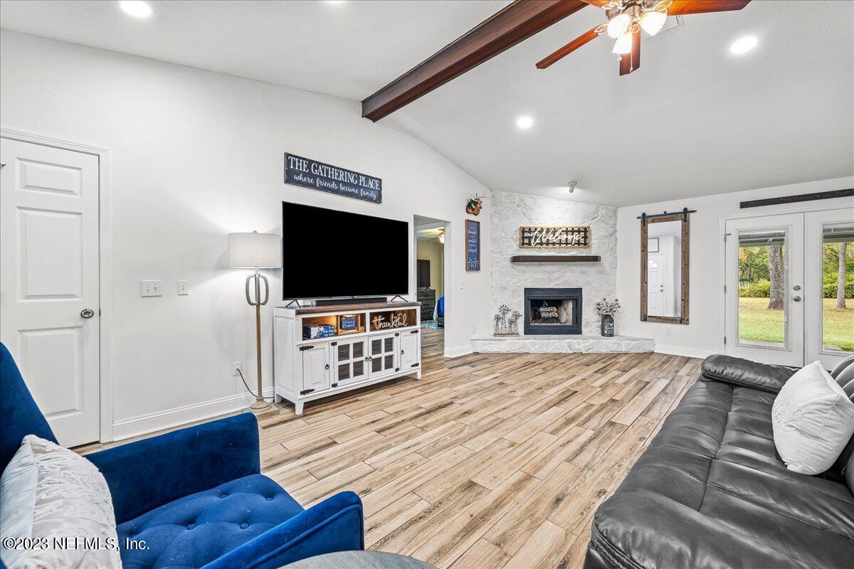 4755 Leopard Circle Middleburg, FL 32068 - Photo 1 of 38 a living room with furniture and a flat screen tv