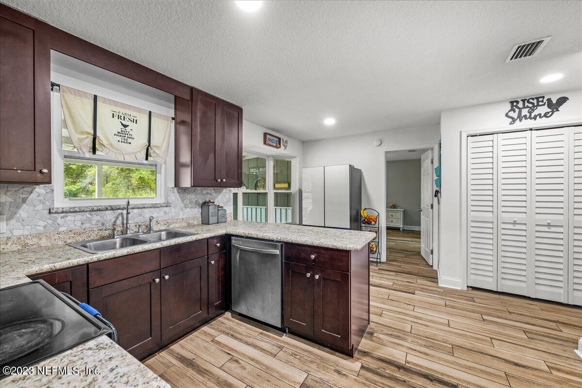 4755 Leopard Circle Middleburg, FL 32068 - Photo 11 of 38 a kitchen with a sink and cabinets