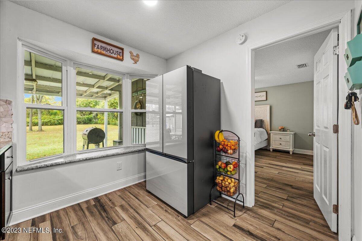 4755 Leopard Circle Middleburg, FL 32068 - Photo 12 of 38 a view of an entryway with wooden floor and a window