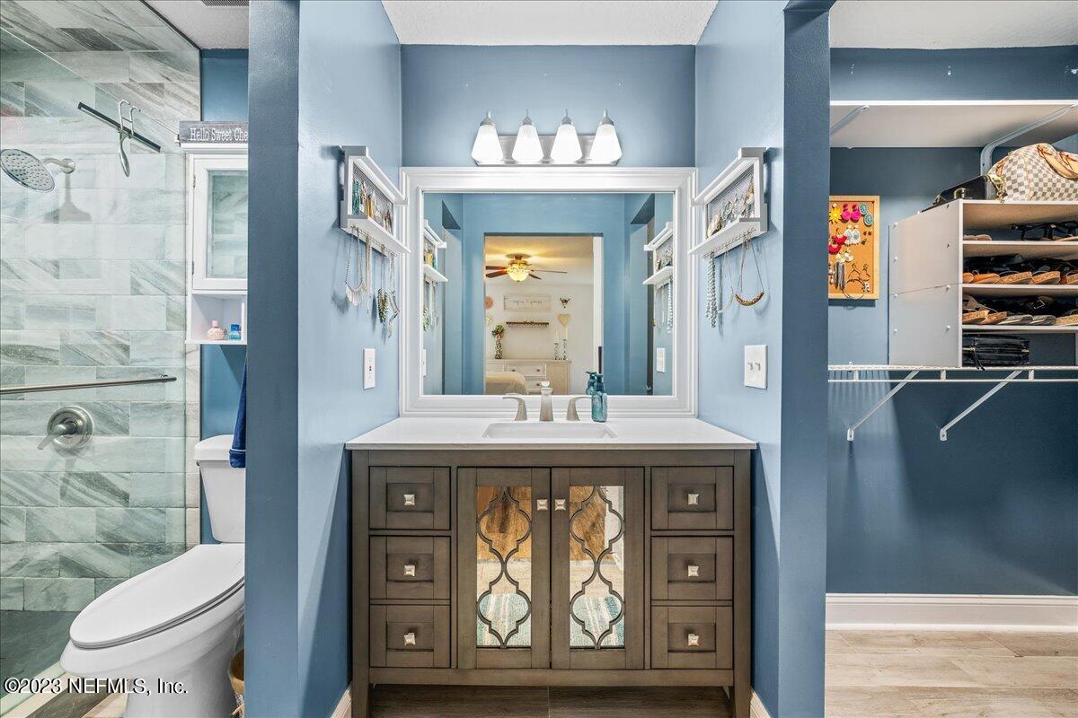 4755 Leopard Circle Middleburg, FL 32068 - Photo 15 of 38 a view of bathroom with a sink and a mirror