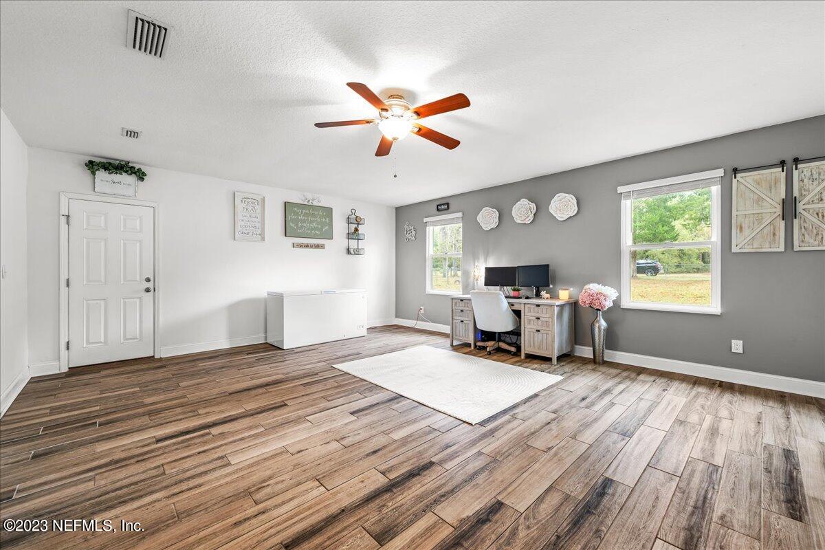 4755 Leopard Circle Middleburg, FL 32068 - Photo 20 of 38 a bedroom with furniture and a window