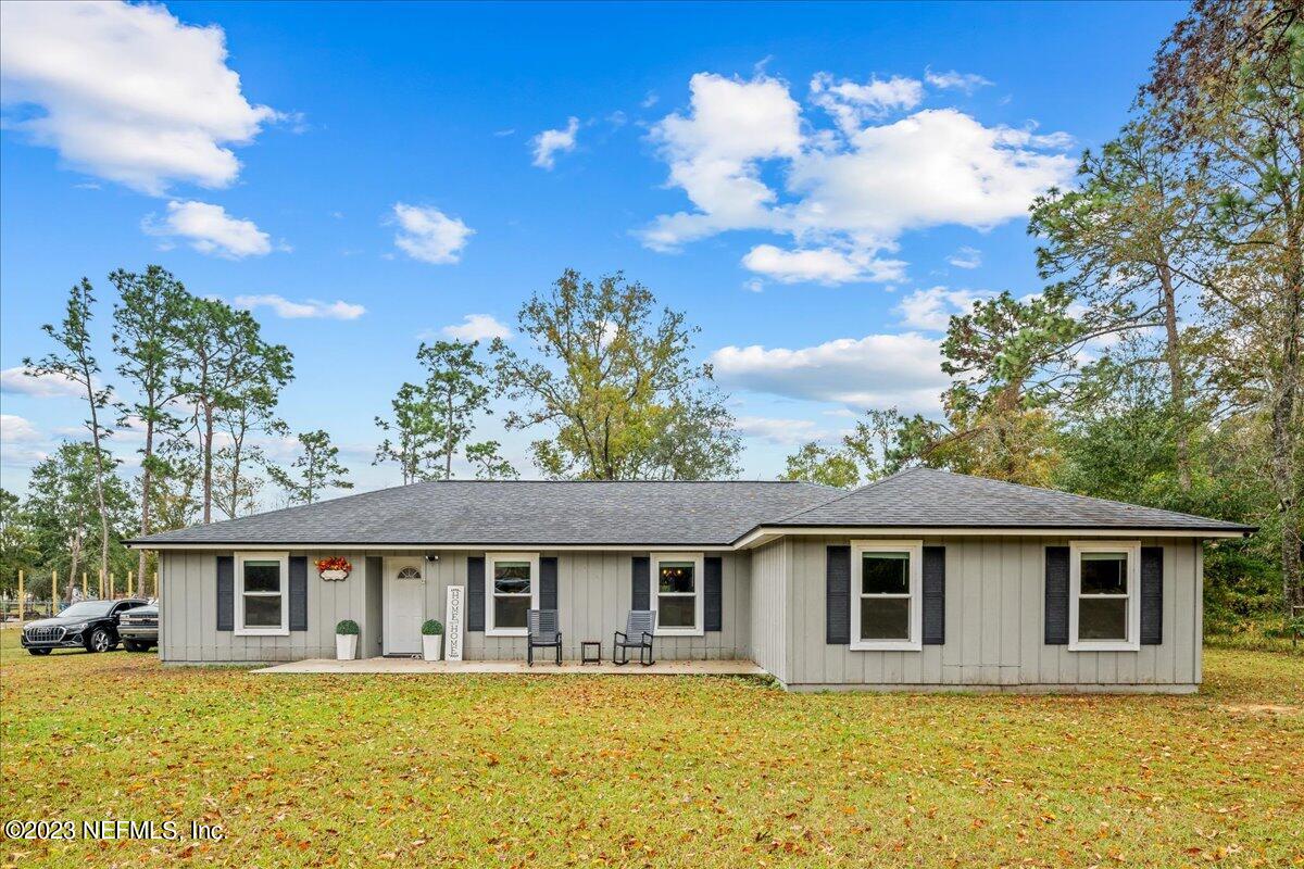 4755 Leopard Circle Middleburg, FL 32068 - Photo 2 of 38 a front view of house with yard and trees around