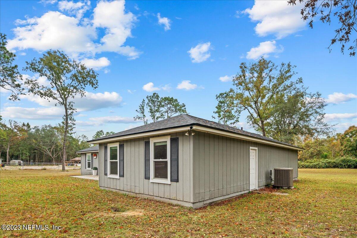 4755 Leopard Circle Middleburg, FL 32068 - Photo 23 of 38 a front view of house with yard and trees