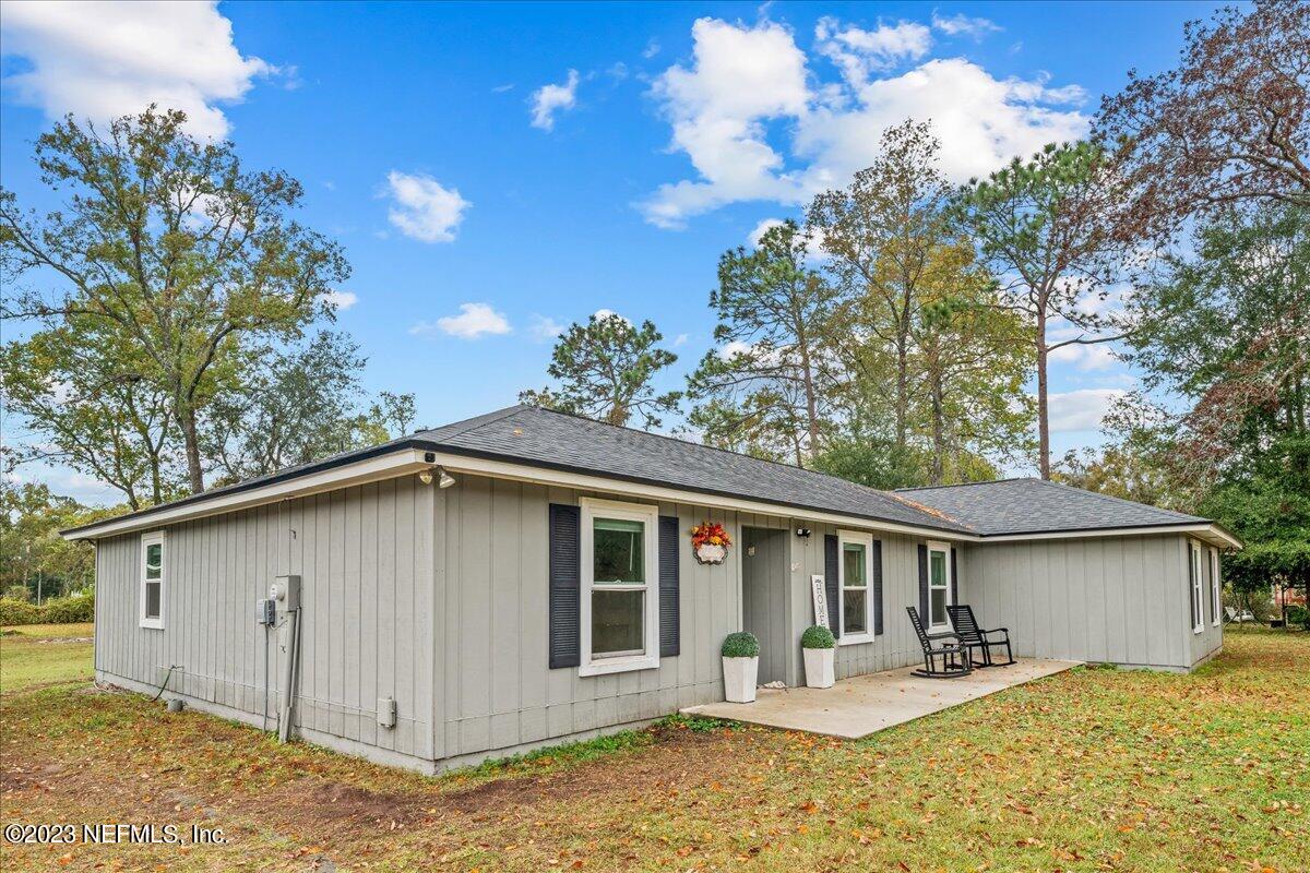 4755 Leopard Circle Middleburg, FL 32068 - Photo 24 of 38 a front view of a house with garden