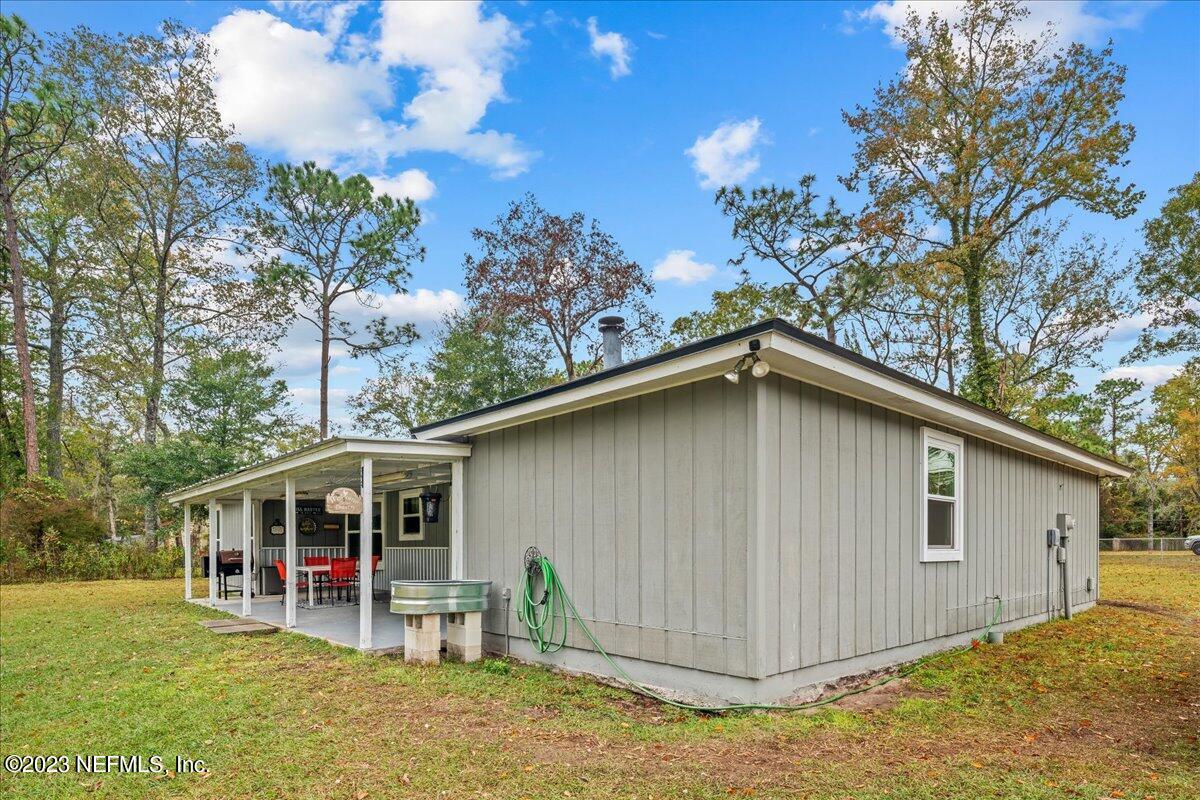 4755 Leopard Circle Middleburg, FL 32068 - Photo 26 of 38 a view of a house with a backyard and porch