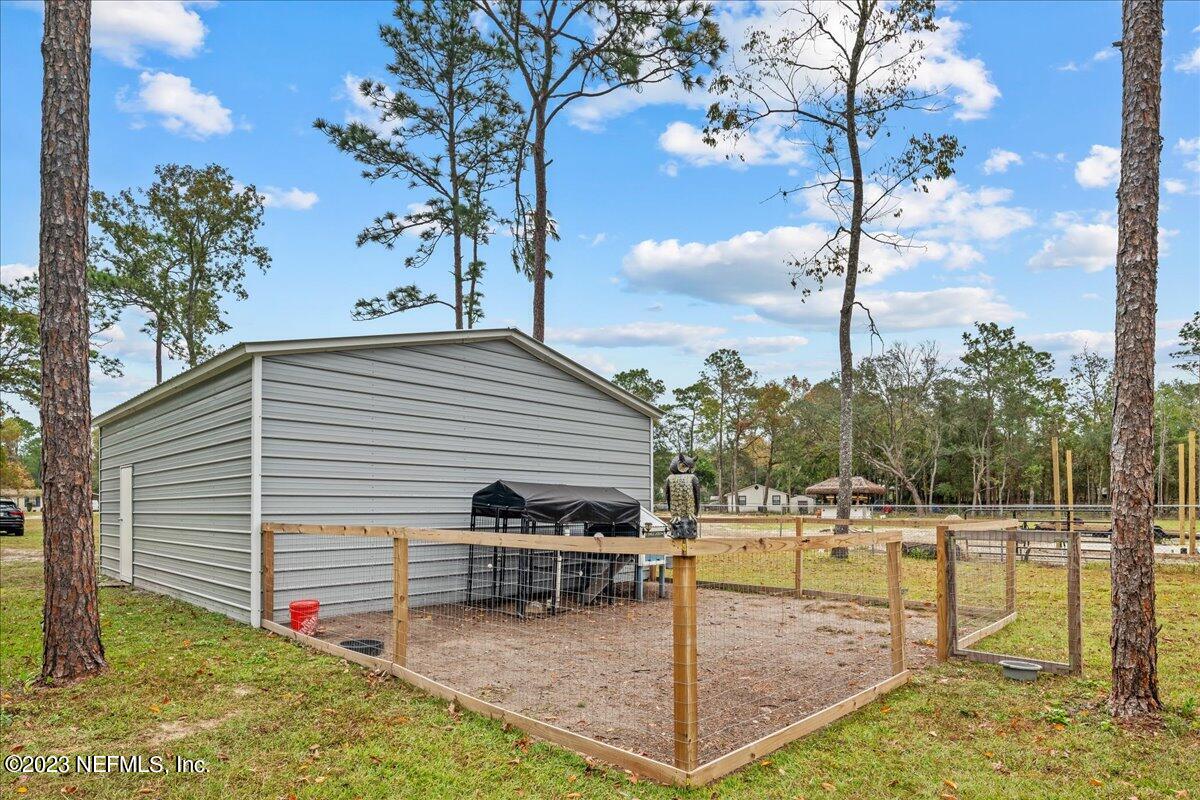 4755 Leopard Circle Middleburg, FL 32068 - Photo 28 of 38 a view of a swimming pool with a patio