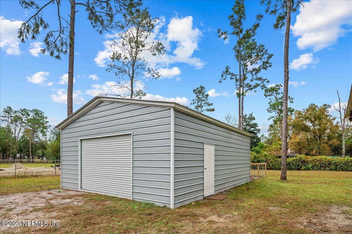 4755 Leopard Circle Middleburg, FL 32068 - Photo 29 of 38 a view of a house with a yard