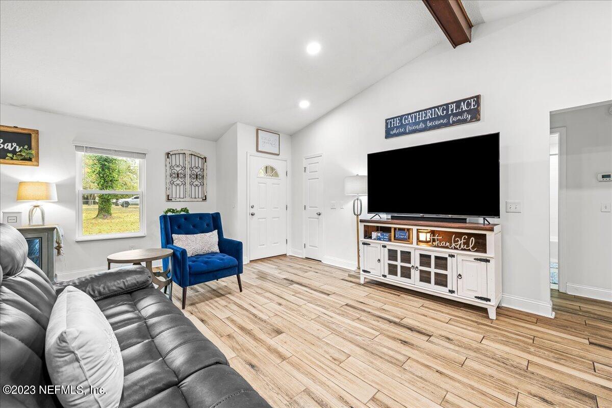 4755 Leopard Circle Middleburg, FL 32068 - Photo 5 of 38 a living room with furniture and a flat screen tv
