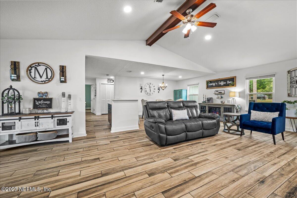 4755 Leopard Circle Middleburg, FL 32068 - Photo 7 of 38 a living room with furniture and a wooden floor