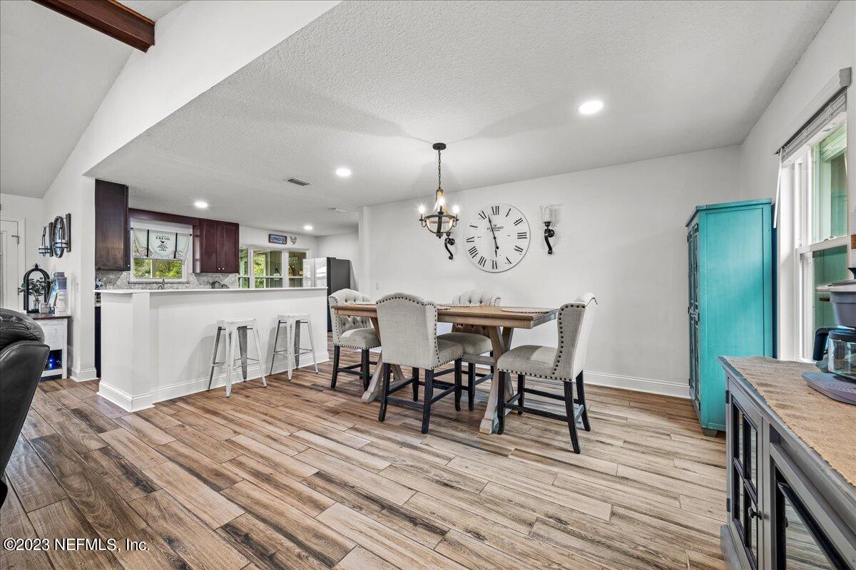 4755 Leopard Circle Middleburg, FL 32068 - Photo 8 of 38 a dining room with furniture and wooden floor