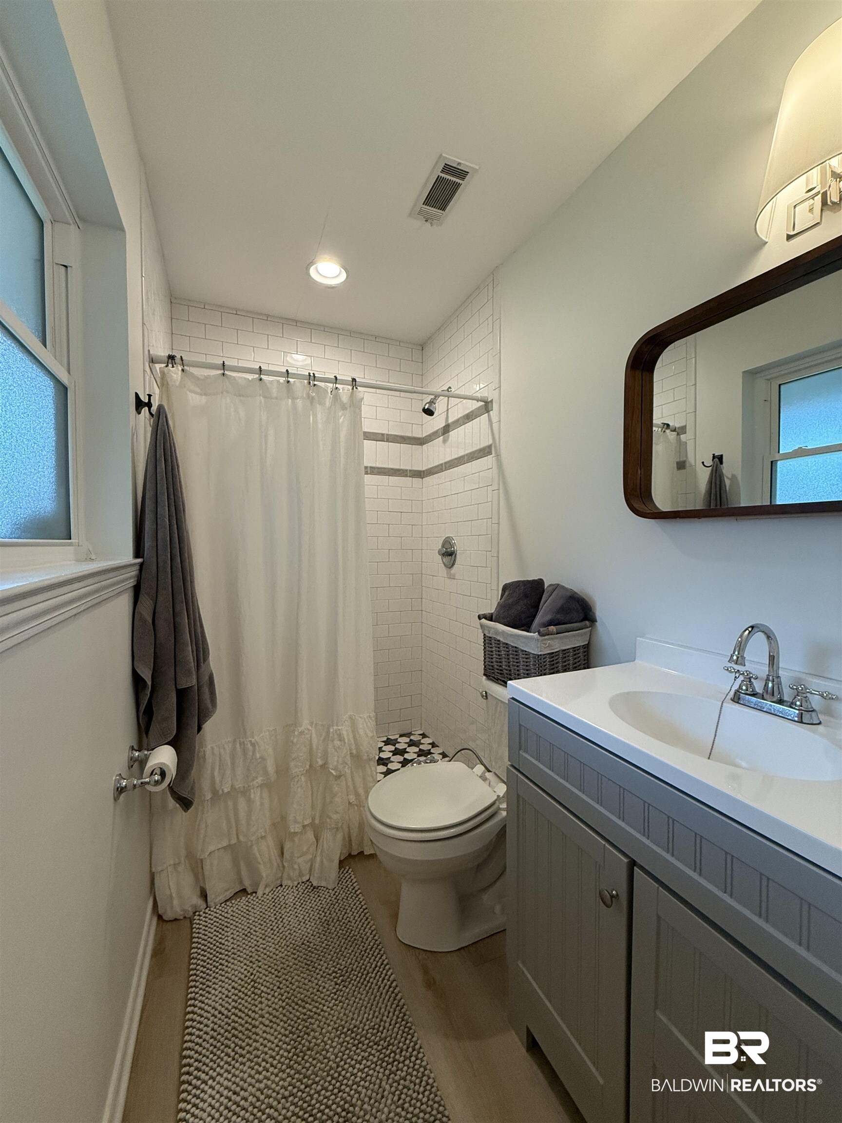 90 Florida Street Monroeville, AL 36460 - Photo 28 of 31 Bathroom featuring vanity, toilet with a bidet, and walk in shower
