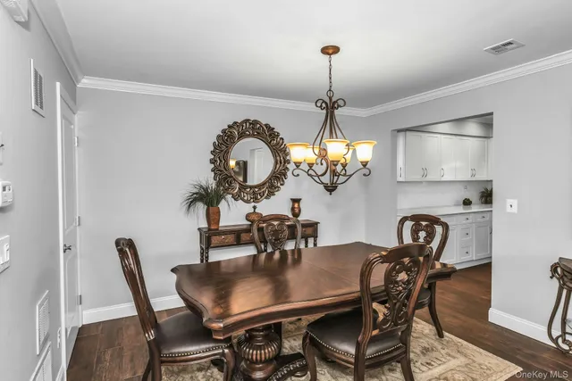 a view of a dining room and chandelier