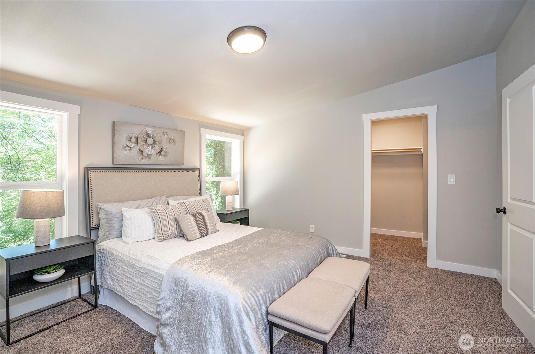 22902 Keating Road Orting, WA 98360 - Photo 21 of 40 a bedroom with a bed and a lamp