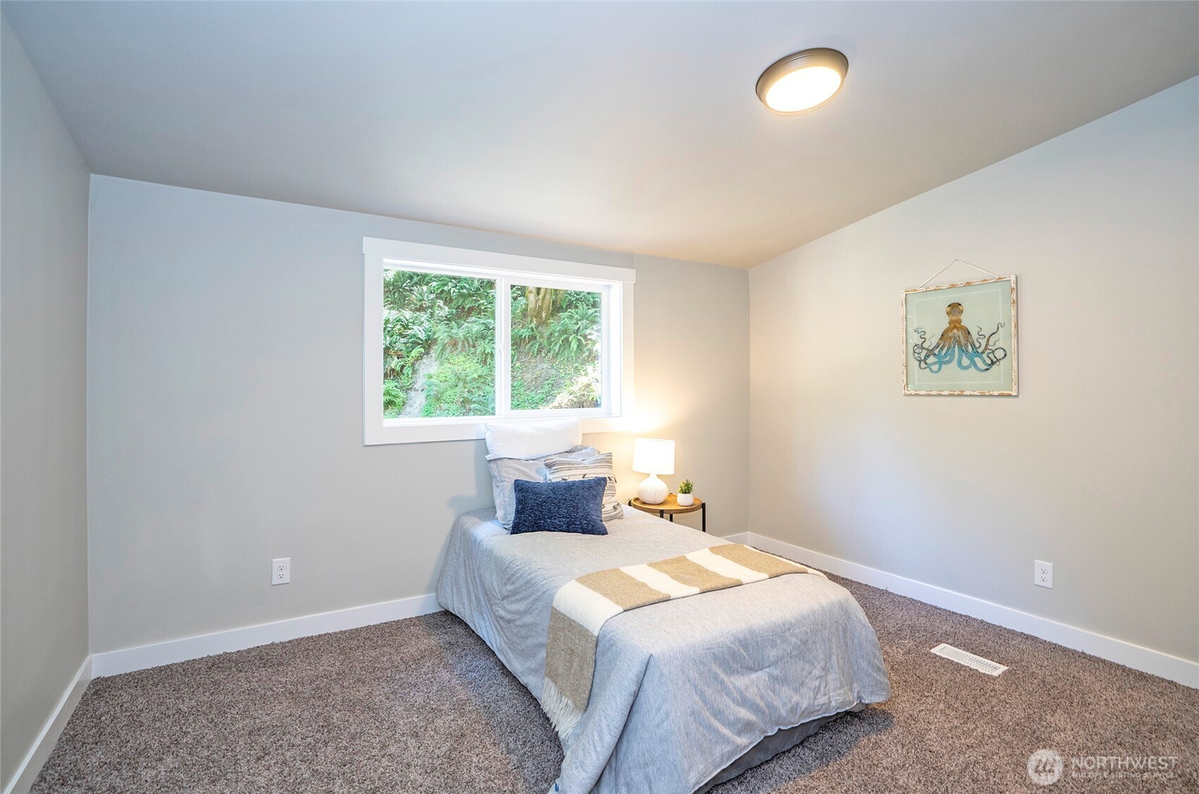 22902 Keating Road Orting, WA 98360 - Photo 23 of 40 a bedroom with a bed and a window