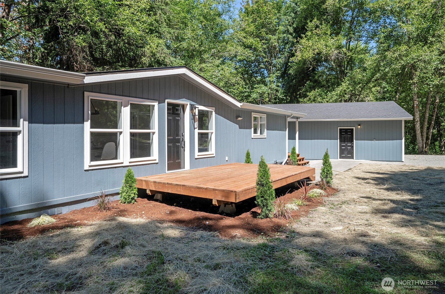22902 Keating Road Orting, WA 98360 - Photo 3 of 40 a house with trees in the background
