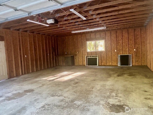 22902 Keating Road Orting, WA 98360 - Photo 38 of 40 a view of an empty room with a fireplace and a window