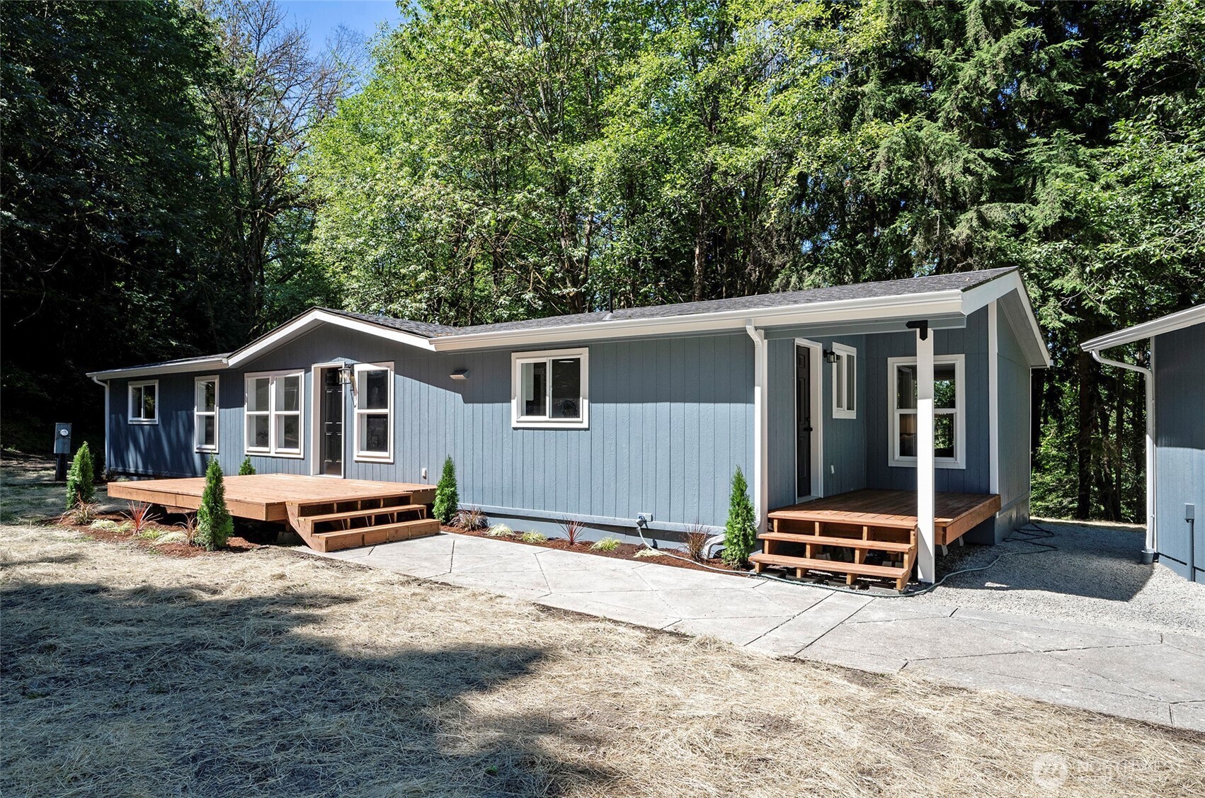 22902 Keating Road Orting, WA 98360 - Photo 4 of 40 a house with outdoor space