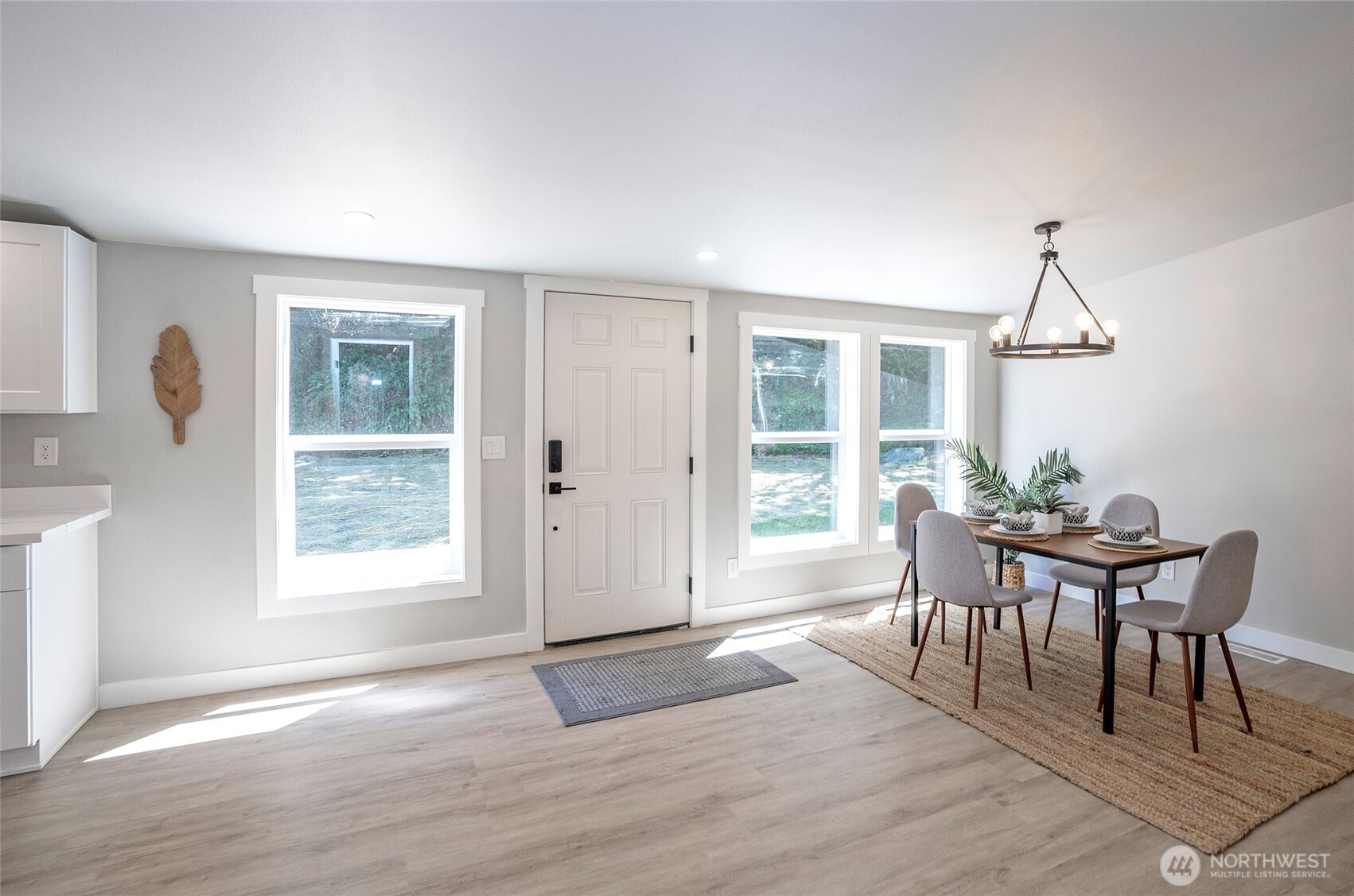 22902 Keating Road Orting, WA 98360 - Photo 6 of 40 a view of a dining room with furniture window and wooden floor
