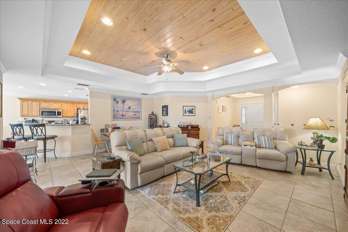 5265 Evinrude Road Melbourne, FL 32934 - Photo 11 of 42 a living room with furniture and a large window