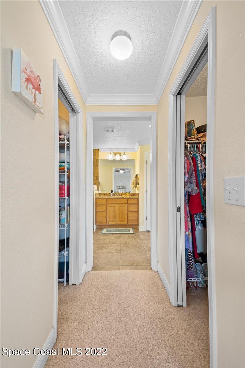 5265 Evinrude Road Melbourne, FL 32934 - Photo 22 of 42 a view of a hallway with closet and a window