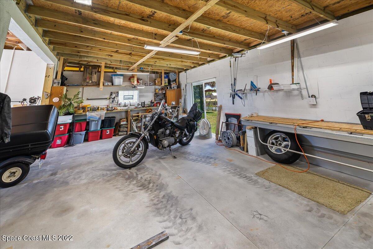 5265 Evinrude Road Melbourne, FL 32934 - Photo 33 of 42 a view of car garage