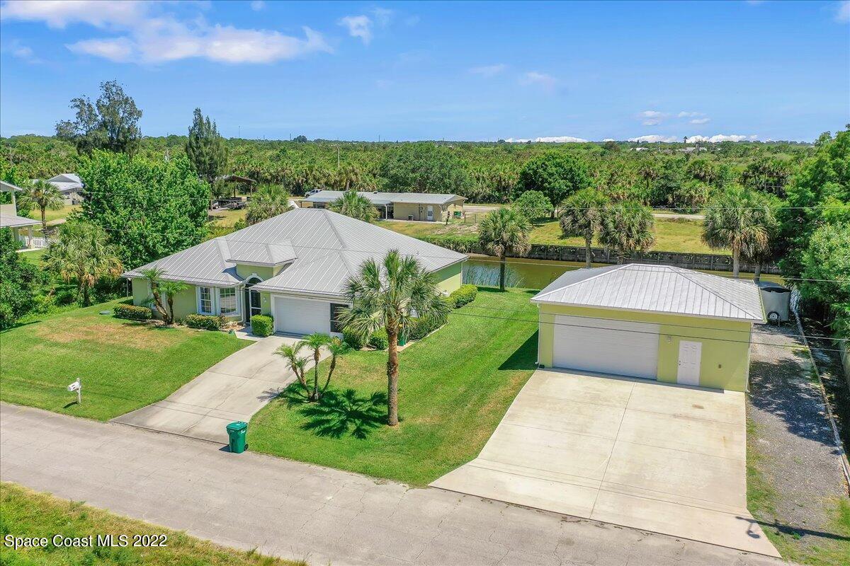 5265 Evinrude Road Melbourne, FL 32934 - Photo 40 of 42 a aerial view of a house