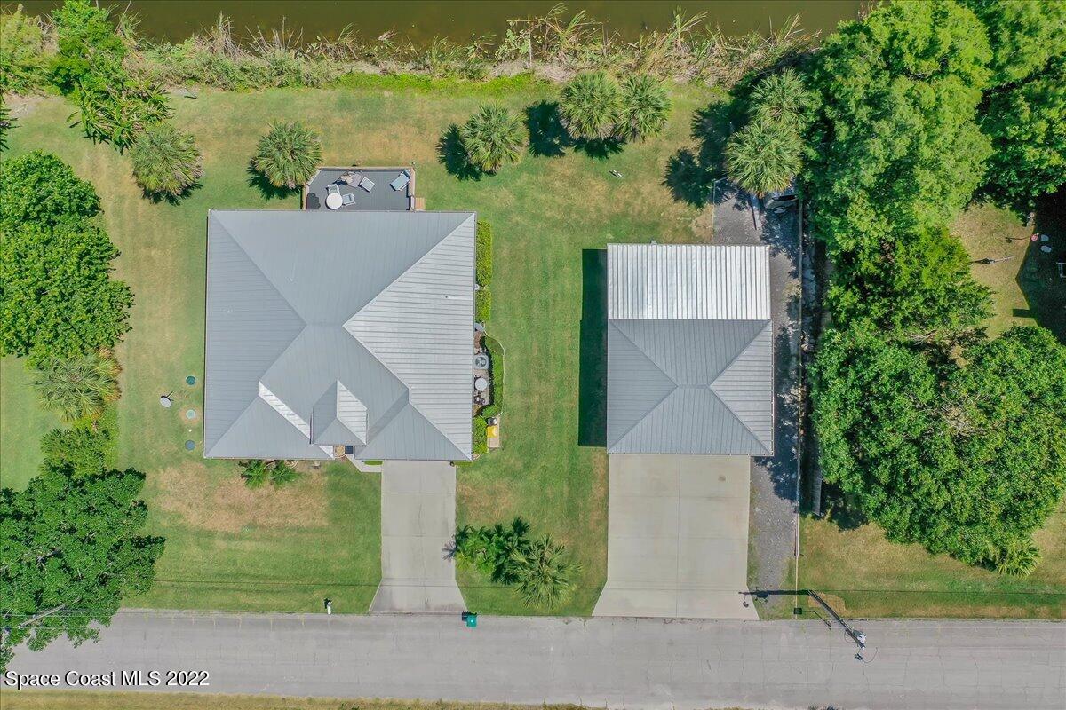 5265 Evinrude Road Melbourne, FL 32934 - Photo 4 of 42 an aerial view of a house