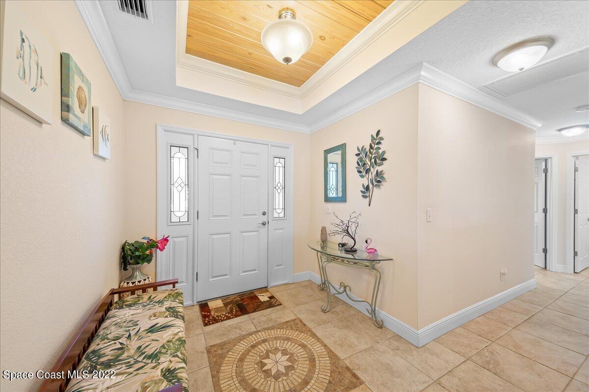 5265 Evinrude Road Melbourne, FL 32934 - Photo 8 of 42 a bedroom with a bed and a window