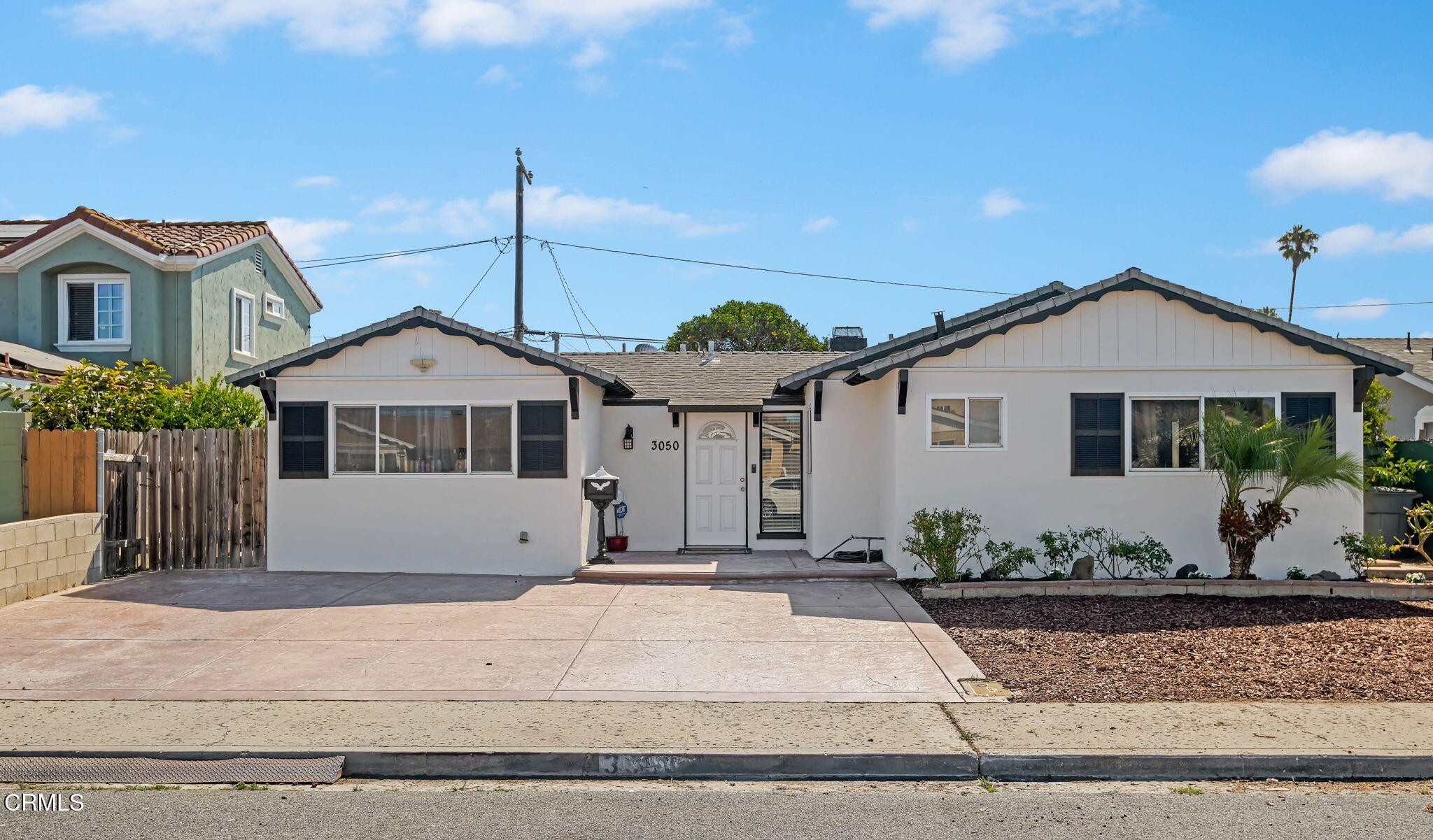 3050 Jackson Street Oxnard, CA 93033 - Photo 1 of 21 a front view of a house with a yard