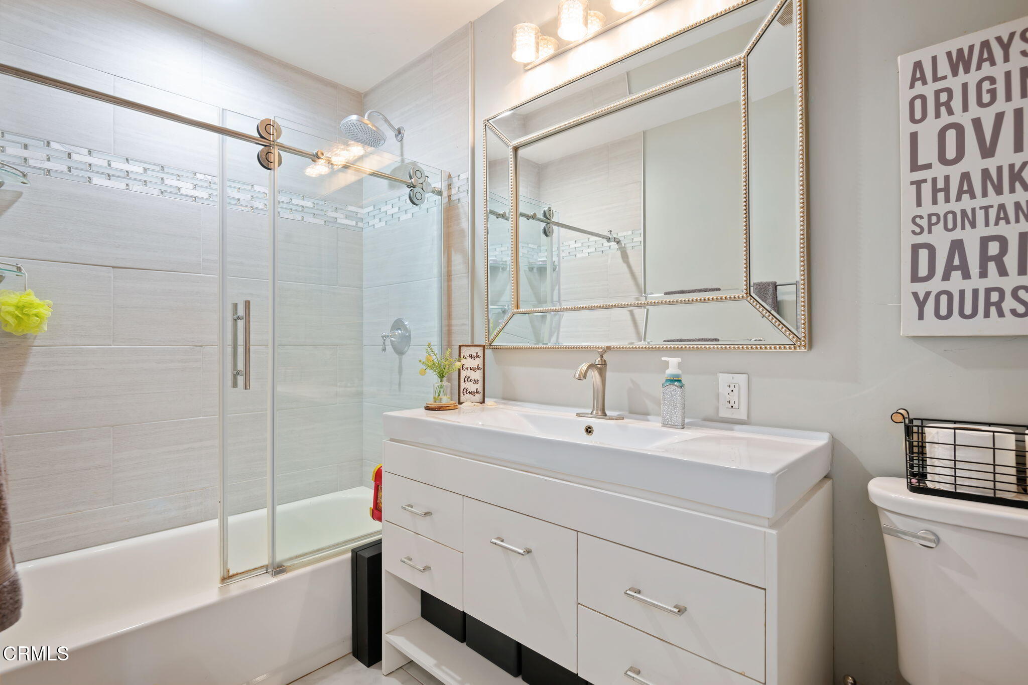 3050 Jackson Street Oxnard, CA 93033 - Photo 15 of 21 a bathroom with a sink a toilet and shower