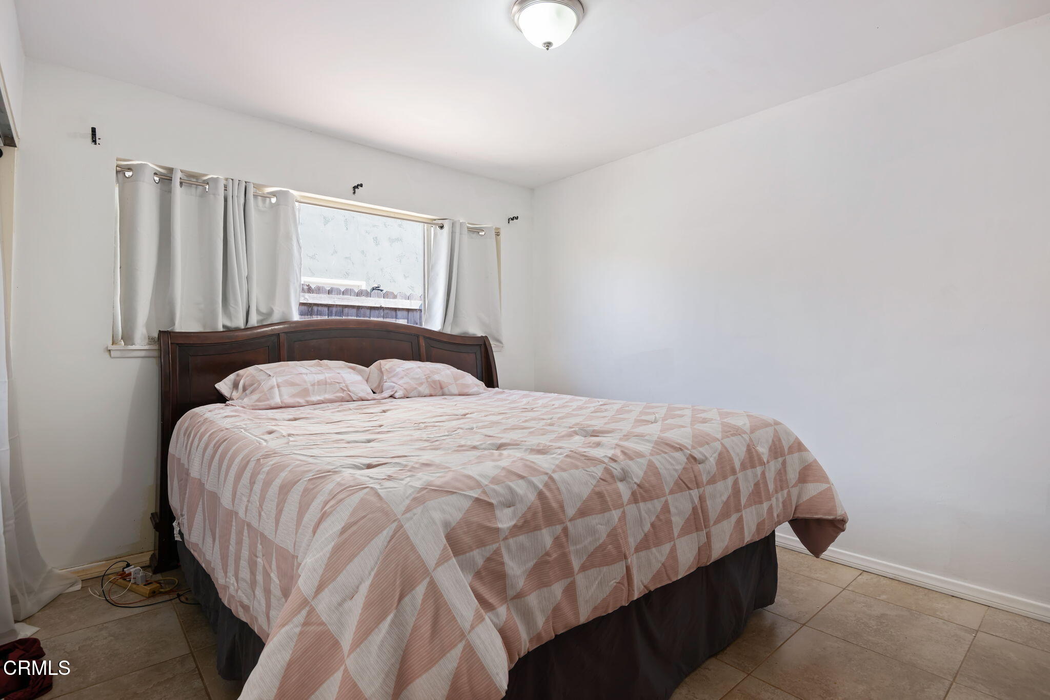 3050 Jackson Street Oxnard, CA 93033 - Photo 16 of 21 a bedroom with a bed and a window