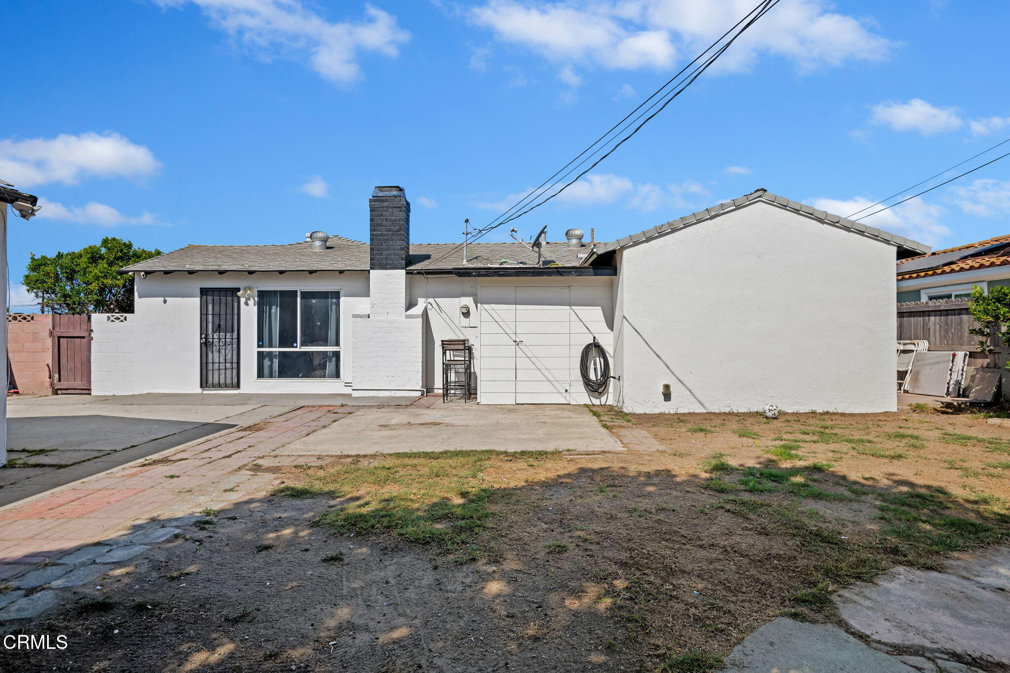 3050 Jackson Street Oxnard, CA 93033 - Photo 19 of 21 a front view of a house with a yard