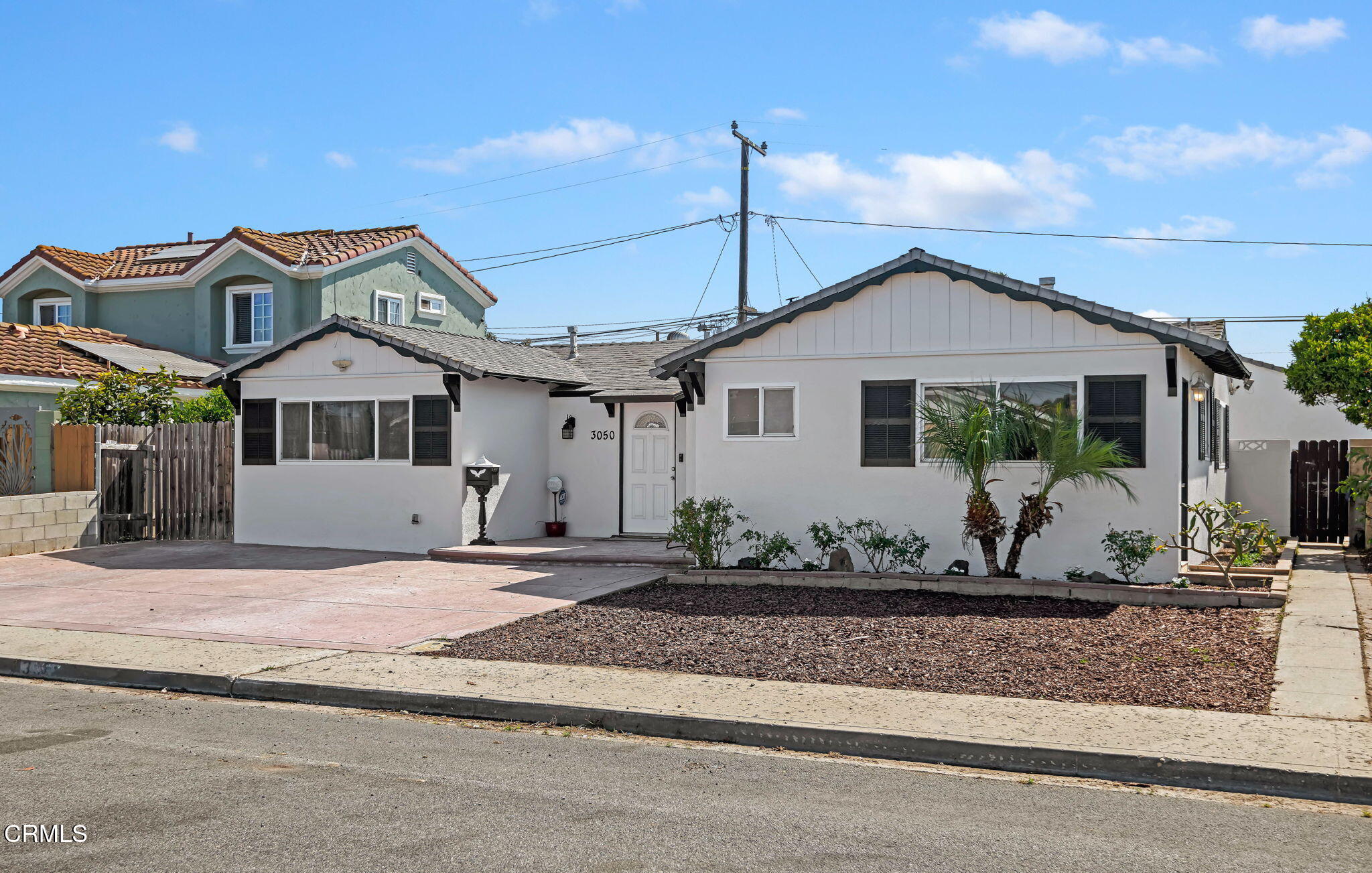 3050 Jackson Street Oxnard, CA 93033 - Photo 2 of 21 a front view of a house with windows