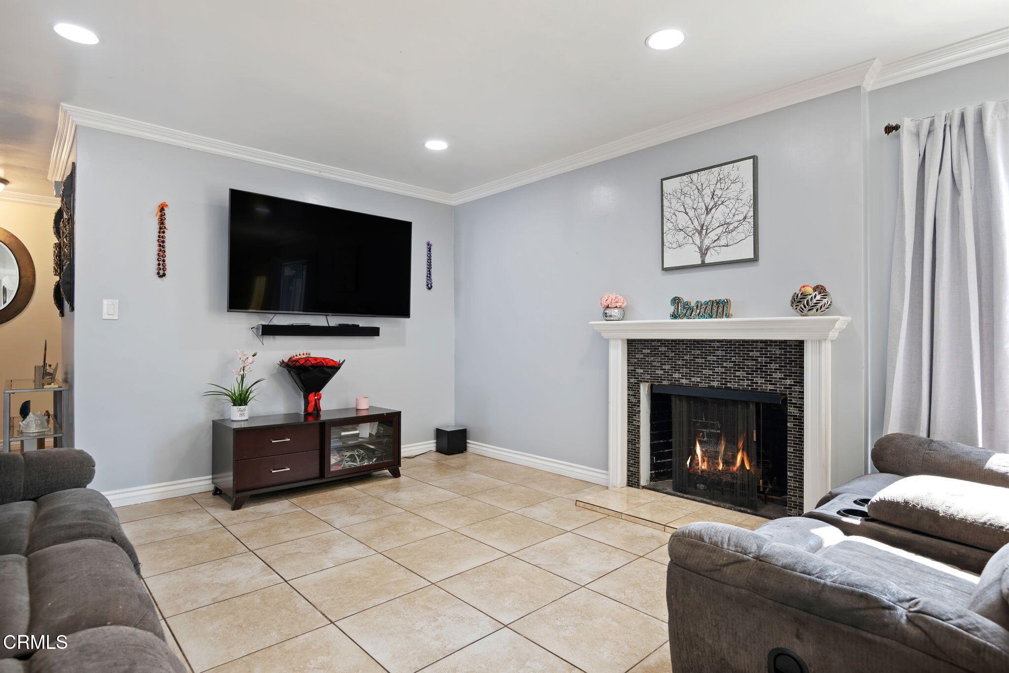 3050 Jackson Street Oxnard, CA 93033 - Photo 7 of 21 a living room with furniture and a flat screen tv