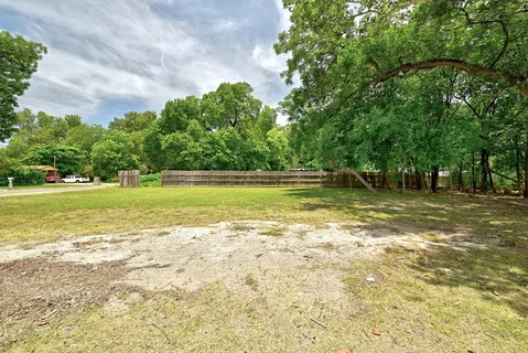 a view of a water fountain and a big yard
