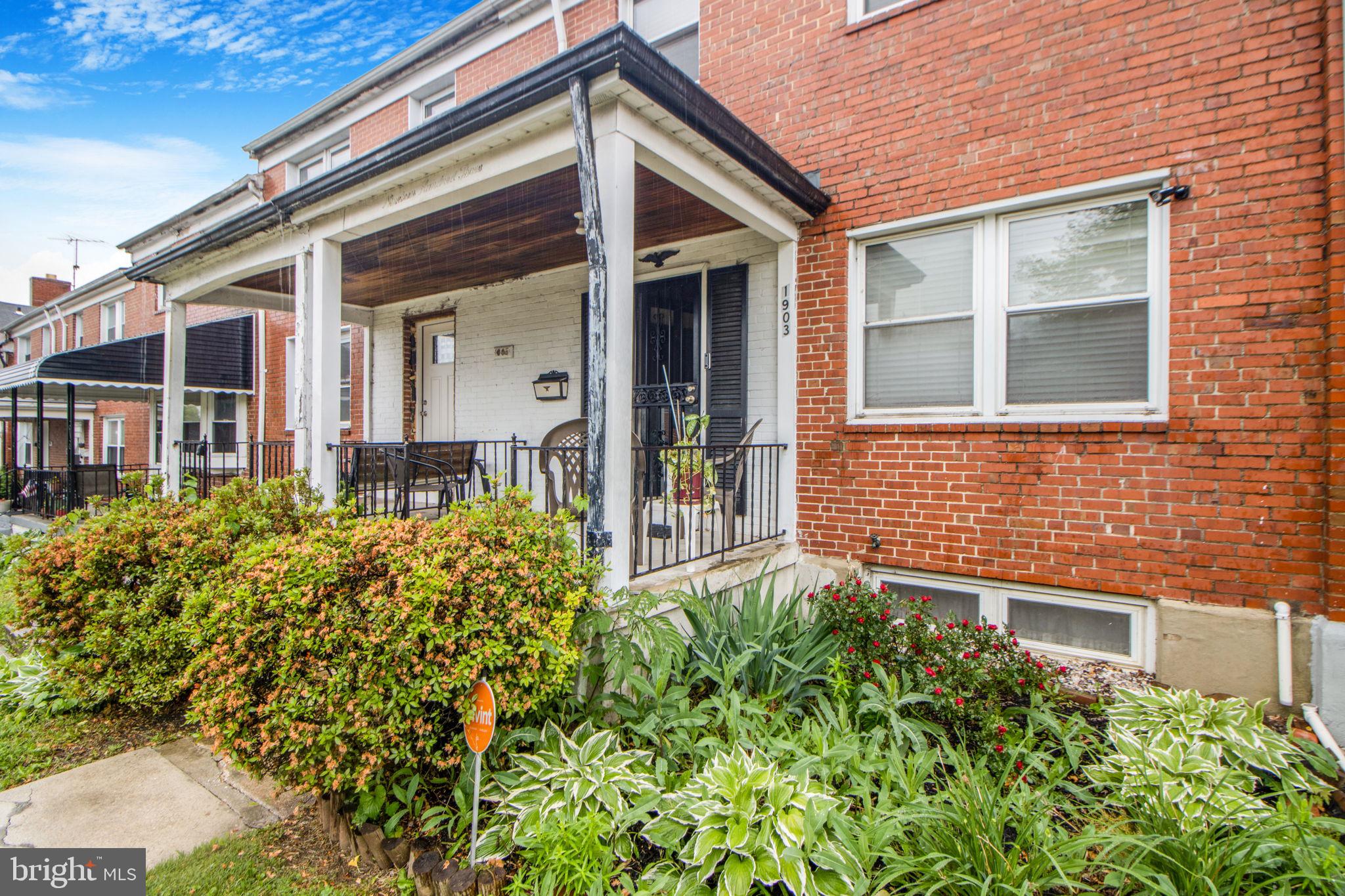 1903 Heathfield Road Baltimore, MD 21239 - Photo 2 of 30 front view of a brick house with a large window