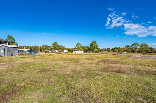 a view of a swimming pool with a yard