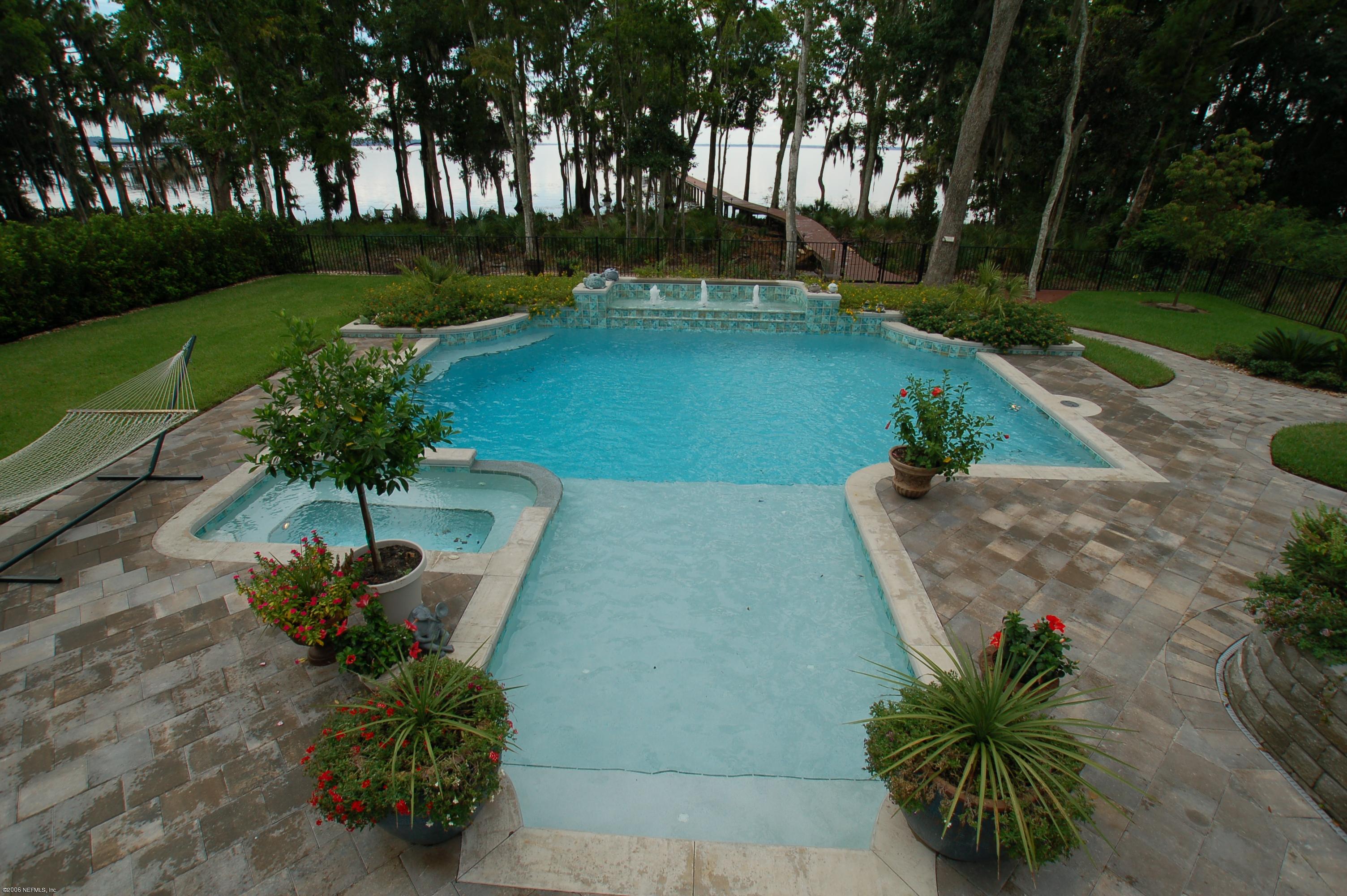 1701 Margarets Walk Road Fleming Island, FL 32003 - Photo 16 of 23 a view of a garden with plants and trees