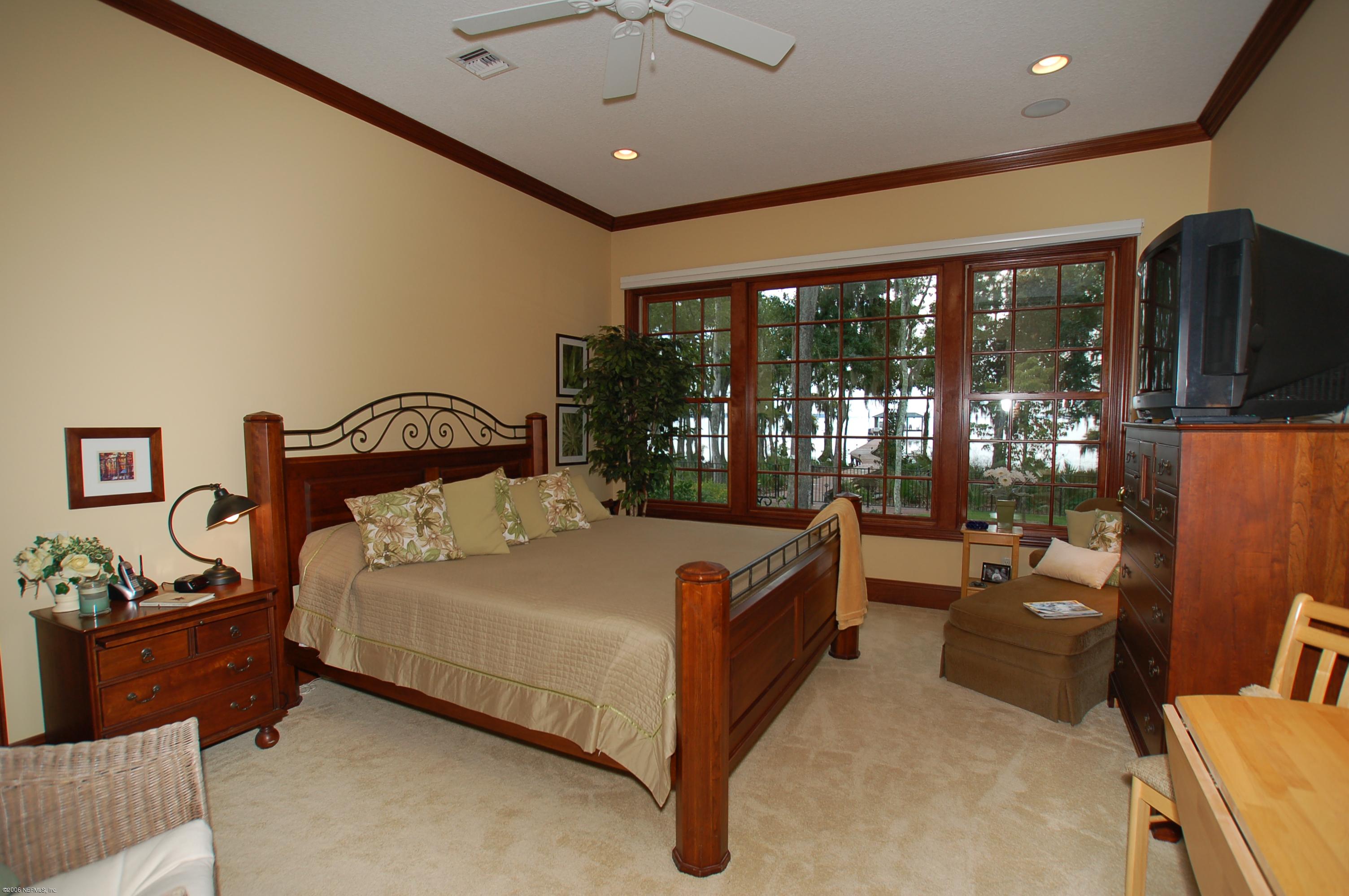 1701 Margarets Walk Road Fleming Island, FL 32003 - Photo 17 of 23 a bedroom with a bed and large window