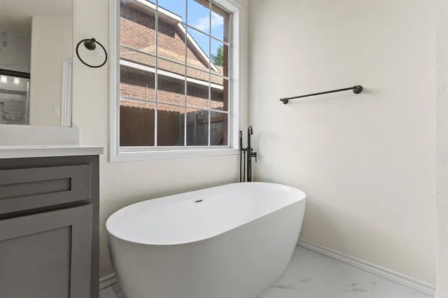 a white bath tub sitting in a bathroom