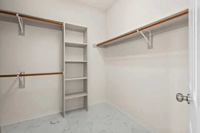 a view of an empty walk in closet