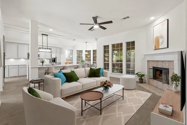 a living room with furniture and a fireplace