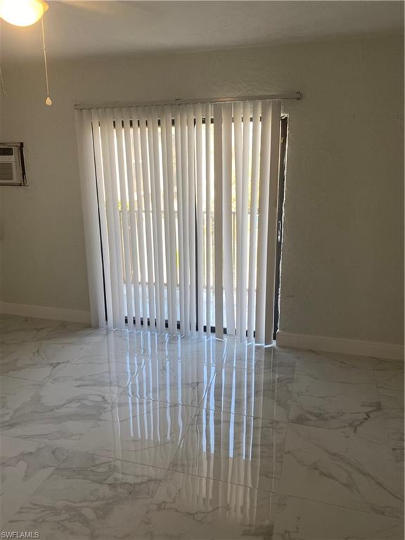 830 Wiggins Pass Road, Unit 10 Naples, FL 34110 - Photo 1 of 6 a view of a porch with a door