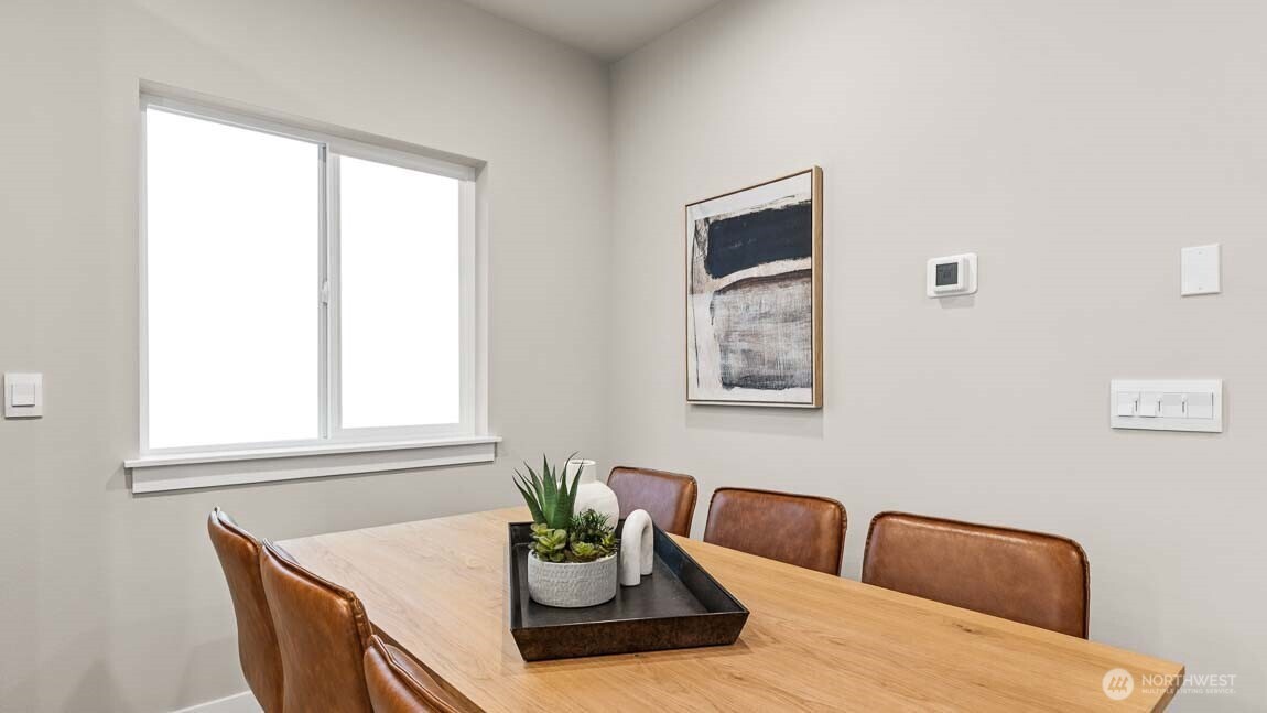 3125 194th Street Southeast Bothell, WA 98012 - Photo 11 of 25 a dining room with furniture and window