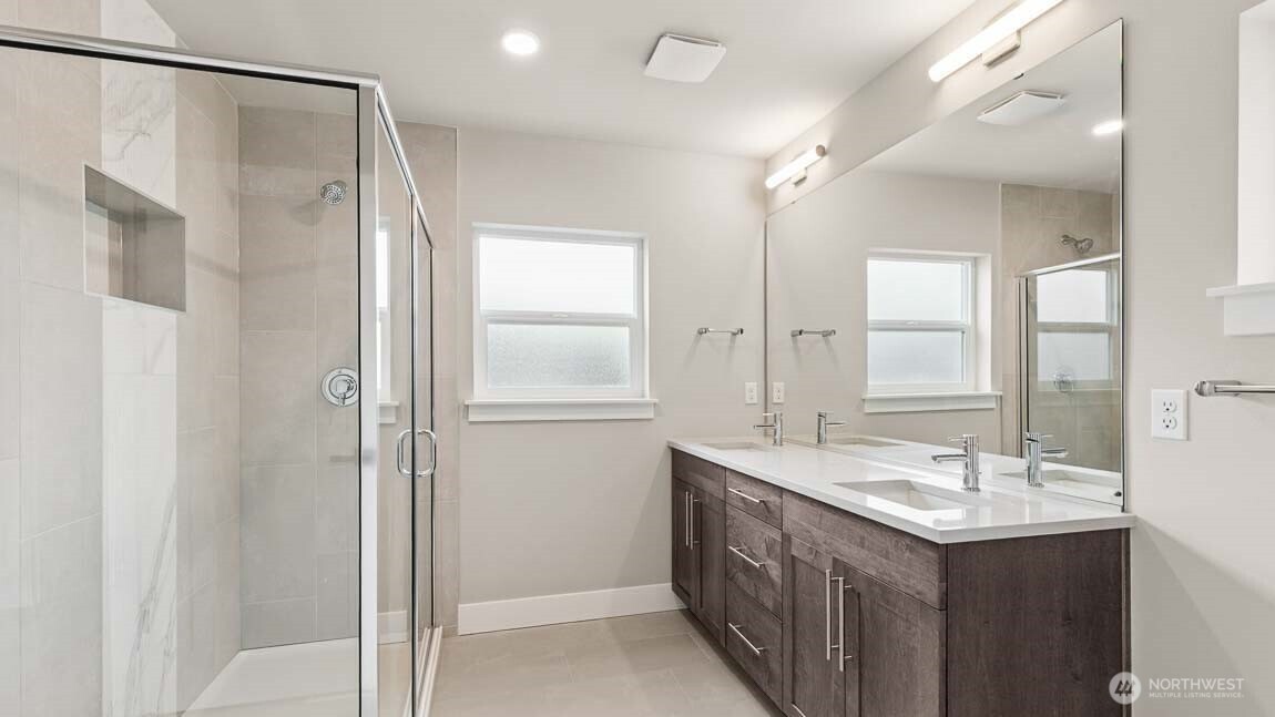 3125 194th Street Southeast Bothell, WA 98012 - Photo 20 of 25 a bathroom with a double vanity sink mirror and shower