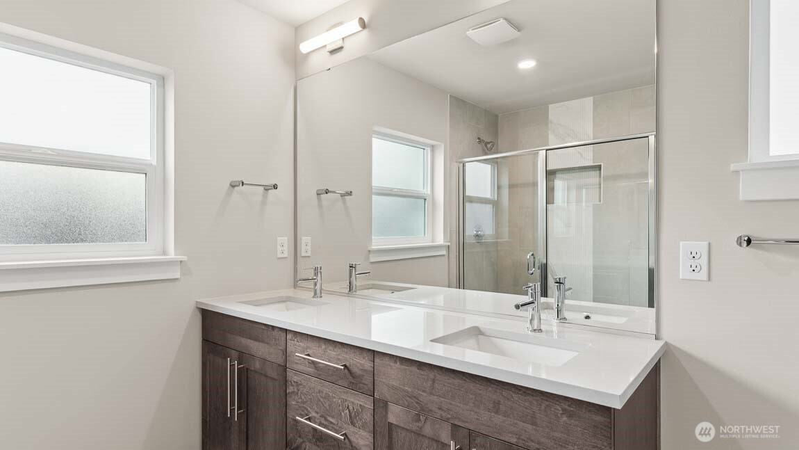 3125 194th Street Southeast Bothell, WA 98012 - Photo 21 of 25 a bathroom with a double vanity sink mirror and double